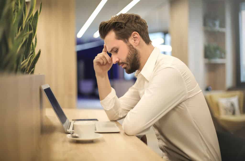 worker at desk with laptop